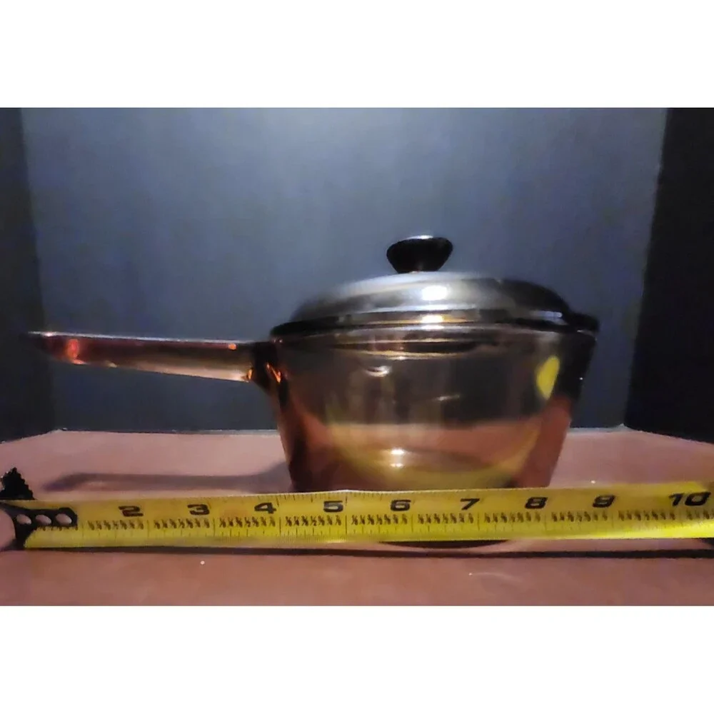 This item appears to be a vintage Corning Visions amber glass 1-liter...